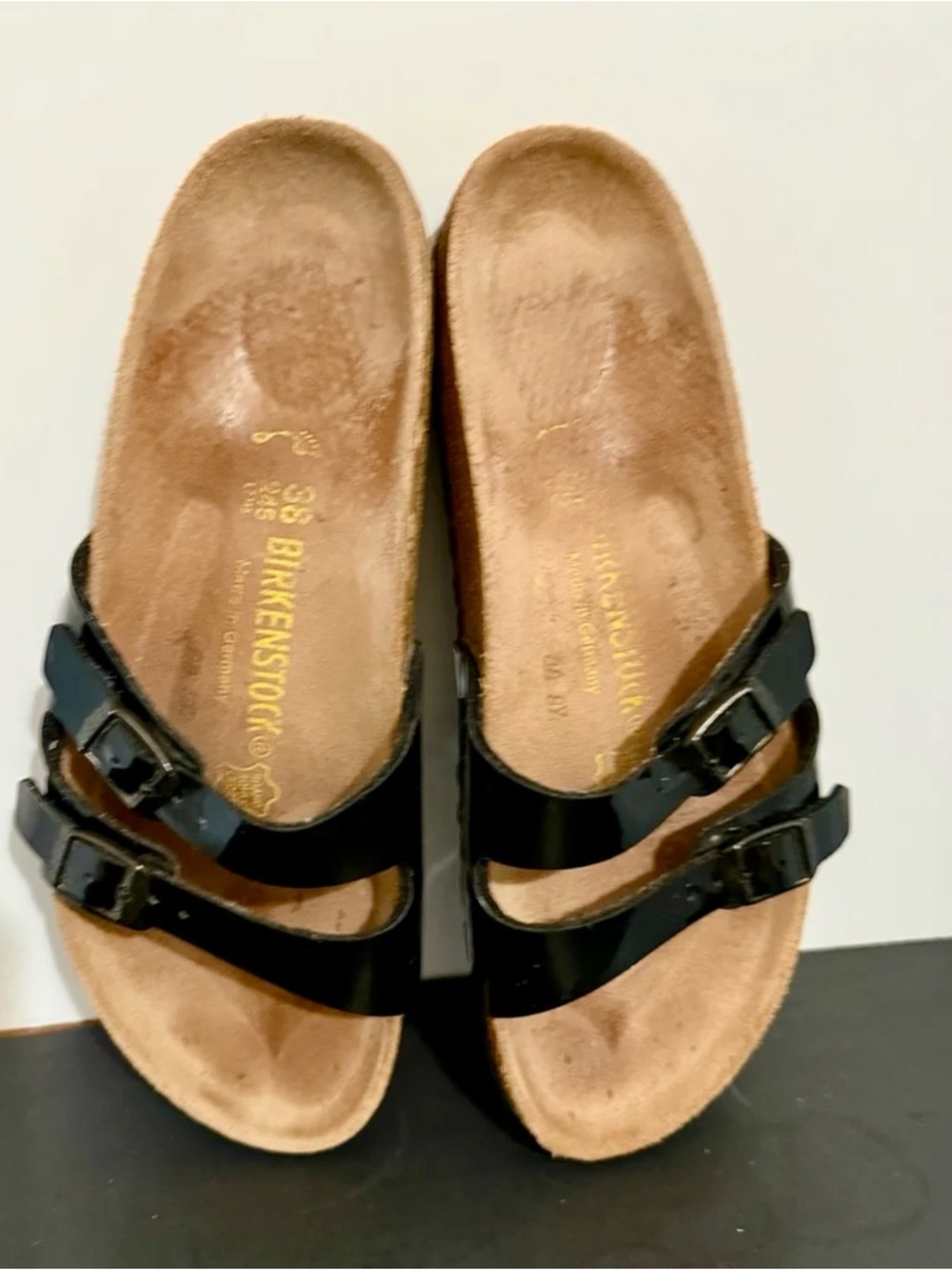 Birkenstock Ibiza double-strap slide sandals in a black patent finish. 7.5